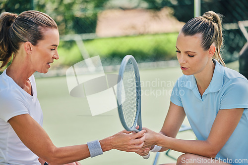 Image of Women hands together, tennis racket and coach with athlete, support or helping hand at training. Woman, coaching and learning for sports, teaching or advice by blurred background outdoor for strategy