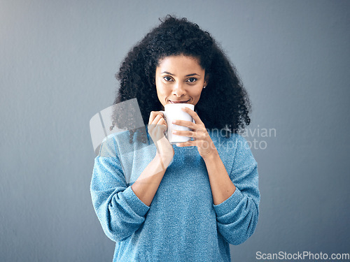 Image of Coffee, tea and portrait of black woman drinking an espresso in a cup isolated in a studio gray background. Morning, relax and female with hot beverage with caffeine for energy and feeling happy