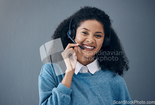 Image of CRM, callcenter face or black woman smile for success B2B deal, support or telemarketing in studio background. Happy or customer service consultant portrait for contact us, telecom or sales network