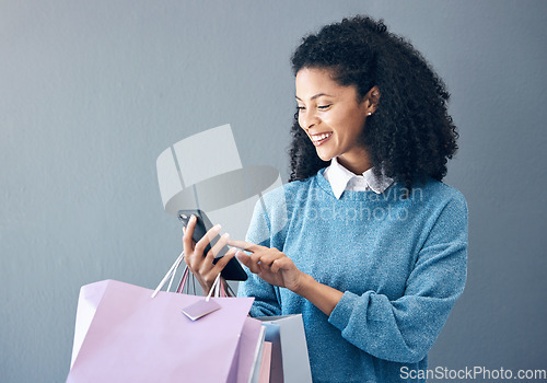 Image of Shopping bag, phone or black woman in mockup studio for fashion sale, discount or luxury brand store. Happy or girl smile on smartphone for social media, promo code or online retail internet app news