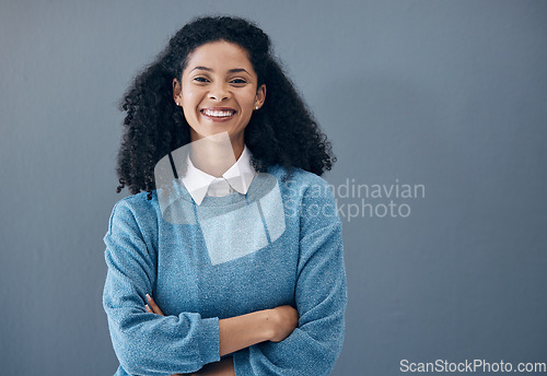 Image of Portrait, fashion and style by black woman smile, excited and happy isolated against a studio gray background. Female, confident and person arms crossed with mockup space and positive mindset