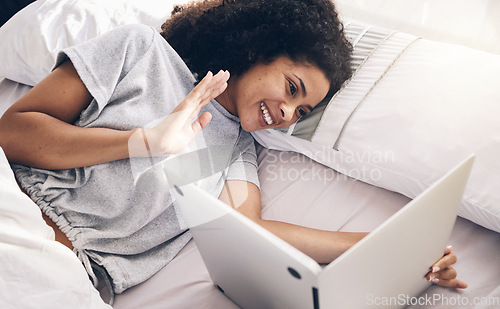 Image of Laptop, video call and woman wave in bed in bedroom for online chat in the morning. Technology, communication and top view of black female waving on videocall while talking to contact with computer.