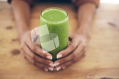 Image of Hands, glass and smoothie with a black woman holding a health beverage for a weight loss diet or nutrition. Wellness, detox or drink with a healthy female enjoying a fresh fruit and mint juice