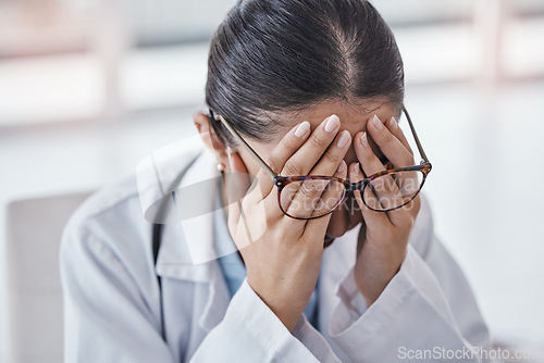 Image of Burnout, stress or doctor woman with headache in office from depression, mental health or anxiety medical review. Tired, pain or sad nurse frustrated, angry or depressed from medicine report mistake