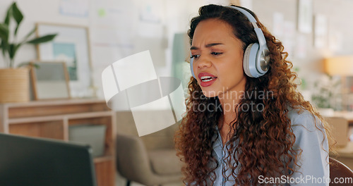 Image of Video call, laptop and woman in fashion business talking, with a smile and headphones in an office at work. Business owner in communication on a creative webinar with tech at a small business