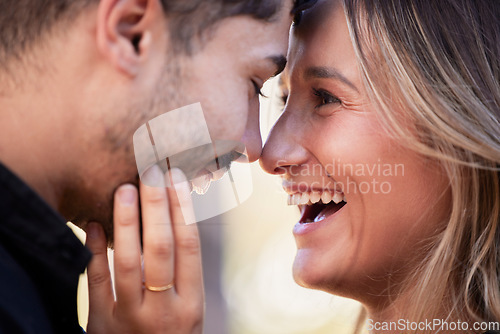 Image of Couple, forehead touch and laugh together with happiness, comic moment or romance outdoor for date. Man, woman and funny time with love, care or happy in nature closeup with hand, face and crazy joke