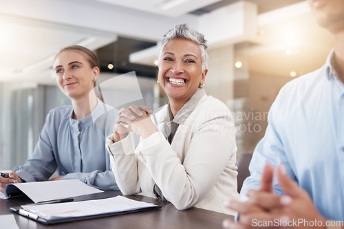 Image of Business woman, smile and portrait in meeting with team, employees or staff in office of success. Happy mature female executive working in management, collaboration and leadership of company workshop