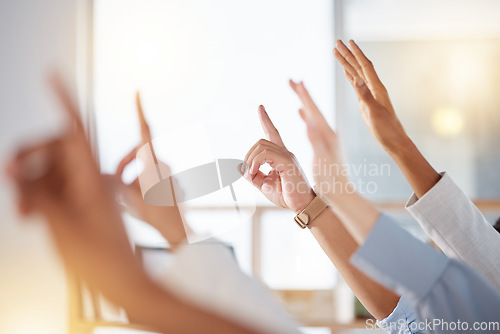 Image of Seminar, diversity and business people raise hands to ask a question at training in the office. Group, multiracial and professional employees at a corporate tradeshow or conference in the workplace.