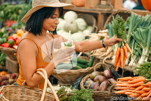 Image of Vegetables, market and black woman shopping for grocery, natural and vegan food at small business. Farm supplier, carrot and young person or customer with basket for retail product, nutrition or diet