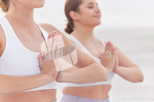 Image of Yoga, meditation and women with hands together, fitness or practice for balance, healthy lifestyle or wellness. Females, ladies or gesture for peace, pilates training or exercise to relax and outdoor