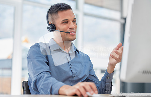 Image of Customer support, call center and male telemarketing consultant doing a consultation online. Contact us, communication and man customer service agent with a headset working on crm strategy in office.