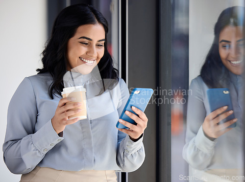 Image of Smile, woman with phone in office on coffee break, browsing social media, surfing internet or typing message. Technology, communication and happy businesswoman standing in lobby reading on smartphone