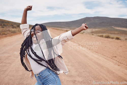 Image of Freedom, excitement and mockup with a black woman dancing in the desert for fun during a road trip. Travel, dance and mock up with a young female enjoying her holiday or vacation outside in nature