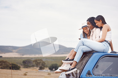 Image of Road trip, car and happy friends with phone, social media update and countryside adventure on sky mockup space. Youth, gen z and diversity women on 5g smartphone and roof for travel journey together