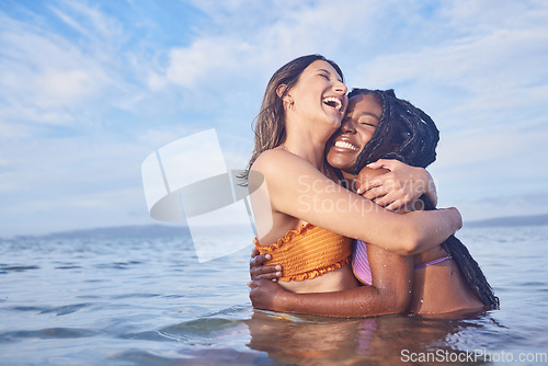 Image of Love, women and couple in ocean, hug and summer vacation with break, celebration and Valetines day. Romance, friends and females on seaside holiday, romantic and loving together, bonding or happiness