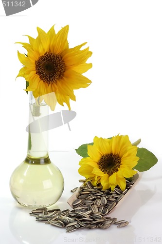 Image of Sunflower Seeds and Oil Bottle