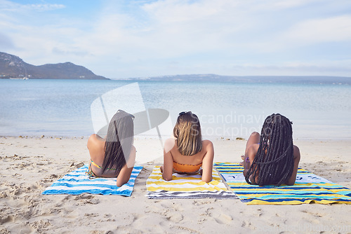 Image of Relax, back and women at the beach for vacation, summer travel and bonding in Bali. Holiday, tropical and friends lying on the island sand during a trip for traveling, quality time and a break