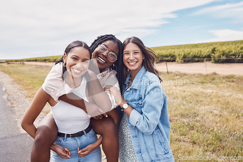 Image of Portrait, friends and piggyback of women on holiday, vacation or trip outdoors. Group freedom, comic adventure and happy girls laughing at joke, having fun or enjoying quality time together in nature