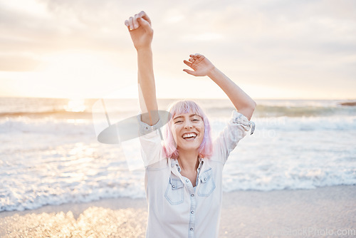 Image of Sunset, beach and portrait of excited woman having fun in waves while on holiday in Indonesia. Smile on face, freedom and travel, happy gen z girl playful on summer ocean vacation with evening dance.