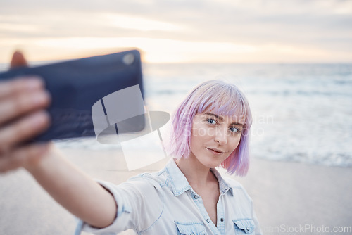 Image of Woman, beach and selfie for profile picture, vlog or social media post on holiday vacation in nature. Female vlogger or influencer with smile for photo memory at the ocean coast in summer break