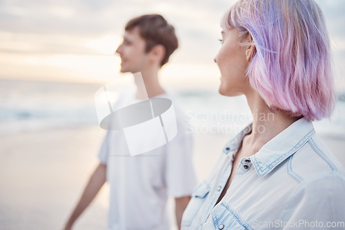 Image of Gen z couple, beach walk and sea holiday of students on vacation at sunset. Ocean, walking and relax young people together with love, care and support outdoor feeling calm with blurred background