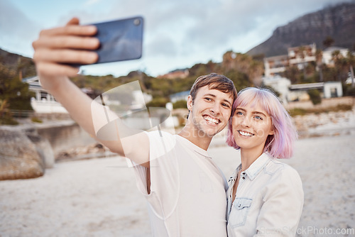 Image of Selfie, love and couple on the beach for a date, travel memory and quality time in Bali. Freedom, care and happy man and woman taking a photo while walking by the ocean during a vacation together