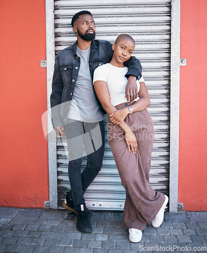 Image of Love portrait, black couple and hug in city, street or outdoors while bonding on valentines day. Romance, support and young man and woman hugging, cuddle and embrace for care and enjoying date time.