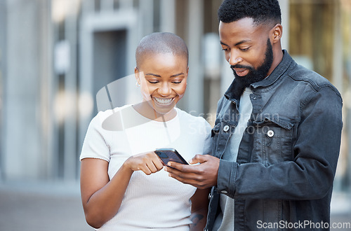 Image of City, happy and couple browsing on a phone with social media, mobile app or the internet. Technology, 5g network and young African man and woman scrolling on a website with a cellphone in town.