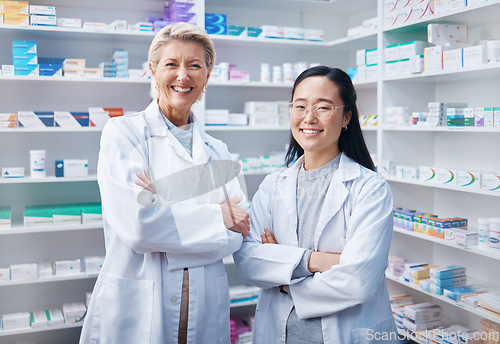 Image of Portrait, women teamwork and pharmacists with arms crossed in pharmacy, drugstore or shop. Healthcare, medication store and happy, proud or confident medical doctors, senior woman and Asian female.