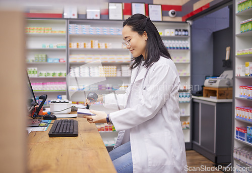 Image of Pharmacy, help and asian woman at checkout counter for prescription drugs scanning medicine. Healthcare, pills and pharmacist from Japan with medical product in box and digital scanner in drugstore.