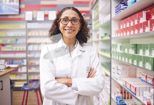 Image of Pharmacy stock, medicine shelf and portrait of a woman pharmacist ready for work. Pharmaceutical store, retail inventory and healthcare drug shelves with a happy employee feeling proud of dispensary