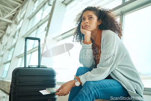Image of Airport, travel delay and sad woman with anxiety for immigration, passport problem or schedule. Young USA person with luggage and stress, worry or thinking of flight fail, crisis or identity mistake