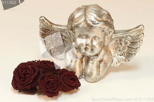 Image of Golden cupid with roses