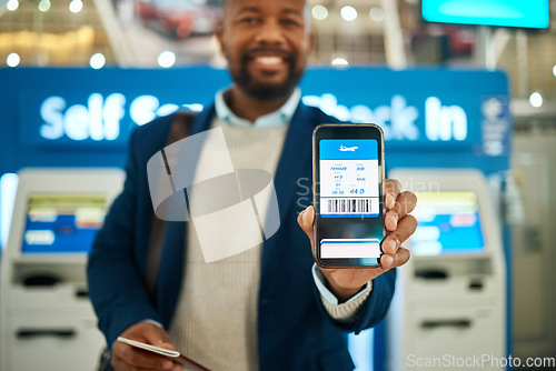 Image of Airport, travel and man with a boarding pass on his phone to check in before his flight for a work trip. Technology, professional and African business male with a electronic plane ticket on cellphone