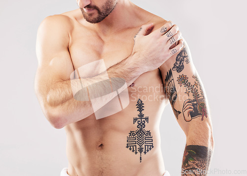 Image of Injury, shoulder and man with arm pain and body stress isolated on a grey studio background. Heart attack, accident and injured person feeling a painful, swollen and inflamed muscle on a backdrop
