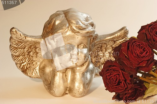 Image of Cupid with red roses