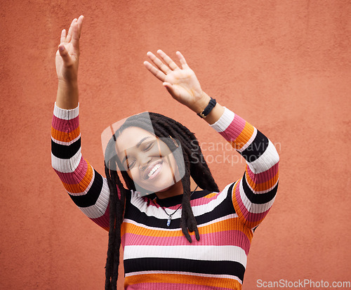 Image of Happy, freedom and smile with black woman and dance for celebration, party and energy. Music, youth and happiness with girl dancing by wall background for fashion, summer and performance in Jamaica