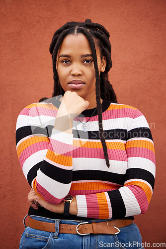 Image of Wall, portrait and black woman with fashion, serious and casual outfit on studio background. Face, African American female and lady with trendy, edgy or confidence with girl, Jamaican and on backdrop