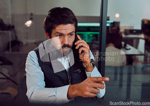 Image of Programmer, phone call and man talking in office, chatting and speaking to contact at night. Information technology, pointing and thinking male employee or coder with mobile smartphone for networking