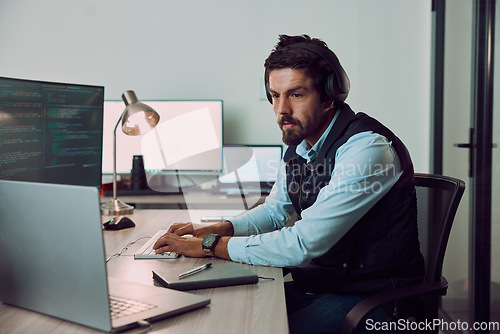 Image of Coding, computer and laptop with man typing, programmer work night for software update, IT and code at desk. Cybersecurity, ux and network with wifi, web design and cyber space with cpu programming