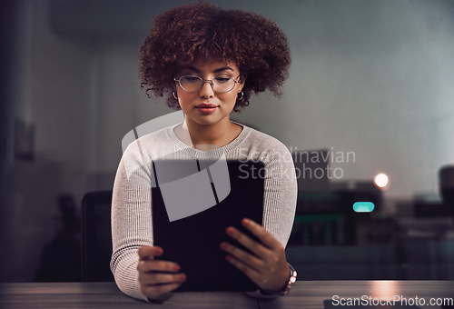 Image of Tablet, programmer and woman in night office, research or programming online in workplace. Information technology, developer and female coder with glasses working on software project on touchscreen.