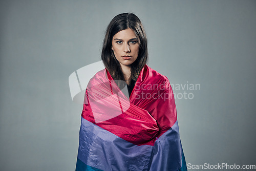 Image of Bisexual flag, pride and woman in portrait, lgbtq and freedom to love, inclusion and equality, protest for human rights. Gay, trans and lesbian identity, politics and community on studio background