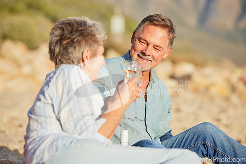 Image of Champagne, beach and love celebration of mature couple with care and support of marriage. Toast, wine and sea picnic of a old man and woman together on holiday in summer loving the sunshine outdoor