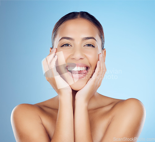 Image of Skincare, beauty and woman with tongue out in studio for makeup, cosmetics and wellness. Happy model, portrait smile and clean teeth whitening for aesthetics, facial salon and glow on blue background