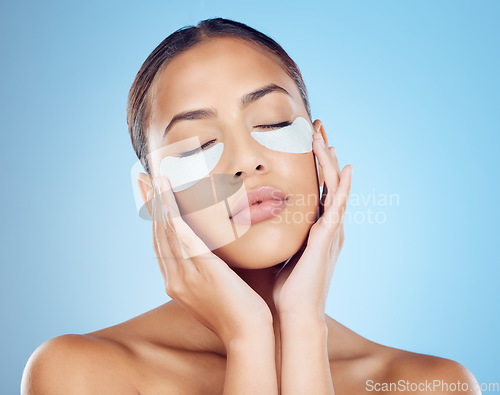 Image of Skincare, mask for eyes and face of woman on blue background for wellness, cosmetics and facial treatment. Beauty, luxury spa and girl relax with eye pads for dermatology, healthy skin and self care