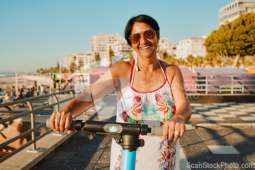 Image of Portrait of woman on electric scooter, retirement and summer ride at tropical island resort for happy vacation. City, street and eco friendly transport, fun grandma on escooter on holiday in Hawaii.