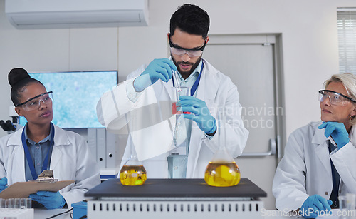 Image of Team, chemistry and liquid in laboratory, science and teaching with experiment, test tube and development. Staff, scientist and researchers with analysis, cure and diagnosis in lab, focus and sample