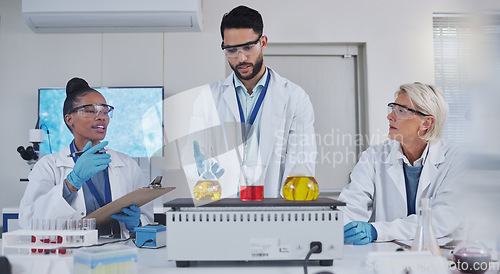 Image of Science, laboratory and team with chemistry liquid in glass beaker for medical research, study and vaccine. Biotechnology, pharmaceutical and scientists with sample for analysis, test and experiment