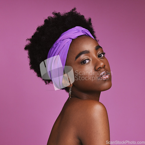 Image of Portrait, beauty and aesthetic with a model black woman on a pink background in studio for natural skincare. Face, hair or headband with an attractive young female posing to promote cosmetics