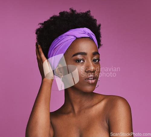 Image of Portrait, hair and skincare with a model black woman on a pink background in studio for natural care. Face, haircare and headband with an attractive young female posing to promote cosmetic treatment